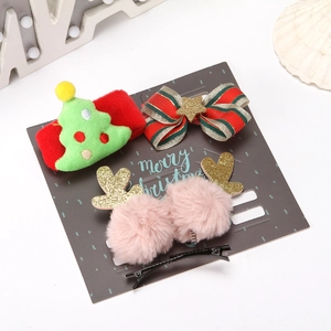 Christmas hair accessory set with plush tree, sequin bow, and reindeer antlers on card