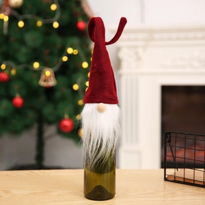 Christmas gnome wine bottle cover with red velvet hat and white faux fur beard decor