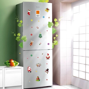 Christmas static window clings featuring Santa Reindeer and Snowman on a fridge
