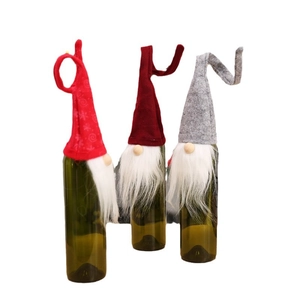 Three-piece Christmas gnome wine bottle covers set with knitted hats and white faux fur beards