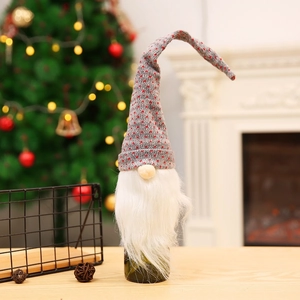 Christmas gnome wine bottle cover with red polka dot hat and white faux fur beard