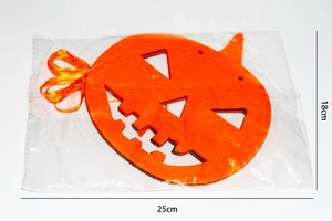 Detail of laser-cut orange felt Halloween pumpkin decoration measuring 25cm by 18cm