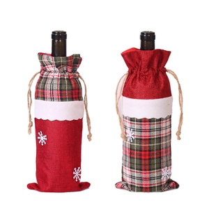 Christmas burlap wine bottle bags with festive plaid patterns and snowflake decorations