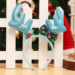 Detail von Weihnachts-Rentier-Geweih-Stirnband mit blauem Glitzer und Karo-Schleife