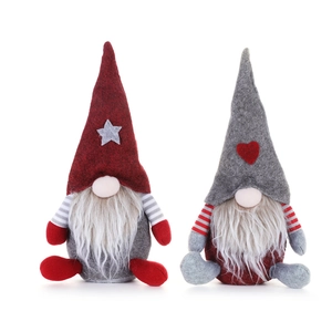 Detail of plush Christmas gnomes with heart and star patterns on pointed hats