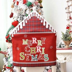 Red Merry Christmas chair covers with plaid trim and plush pom-pom holiday decorations