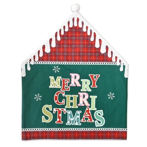 Detail of Christmas chair cover with cabin shape and Merry Christmas text print
