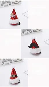 Close-up detail of three Christmas hat hair clips with red sequins and festive decor