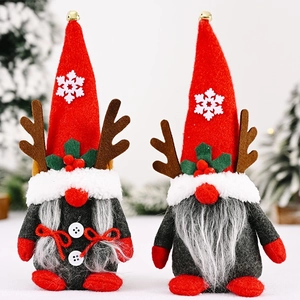 Set of two festive Christmas faceless gnomes with reindeer antlers and golden bells