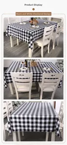 Detailed views of a black and white checkered tablecloth on a white dining table