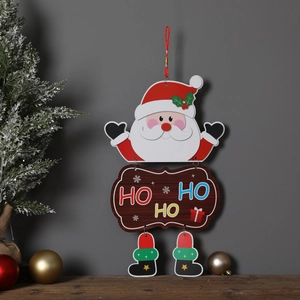 Detail of Santa Claus hanging sign with HO HO HO wooden plaque and festive boots