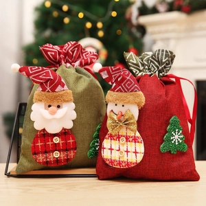 Christmas burlap drawstring gift bags with Santa and Snowman designs for holiday candy and gifts