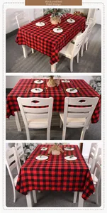 Detail view of red and black buffalo plaid tablecloth in festive dining room setting