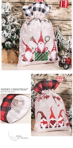 Detail of Christmas gnome drawstring gift bags with plaid trim and rustic burlap texture