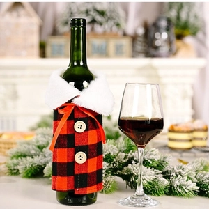 Christmas buffalo plaid wine bottle cover with white fur collar and orange ribbon bow