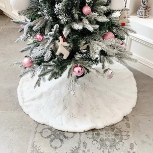 White faux fur Christmas tree skirt with silver embroidered snowflakes and plush texture