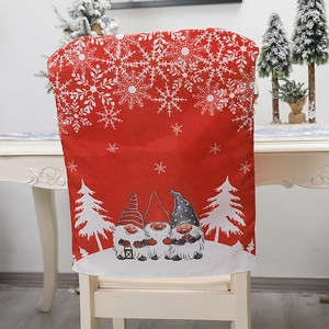 Christmas gnome chair cover with red background and snowflake patterns for festive dining decor
