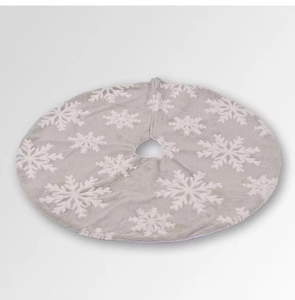 Detailed view of plush grey Christmas tree skirt featuring white snowflake patterns