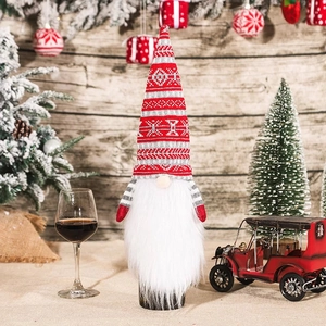 Knitted Christmas gnome wine bottle cover with snowflake pattern and long white beard decor