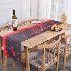 Halloween table runner with bloody handprints and Happy Halloween text for party decor