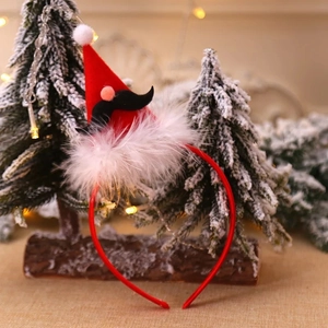 Christmas headband with Santa Claus red felt hat and mustache on festive wood background