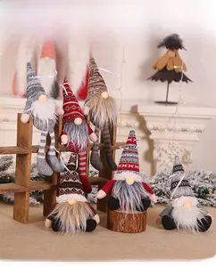 Detailed view of assorted knit Christmas gnome plush ornaments with intricate patterns