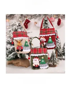 Detailed view of Christmas burlap gift bags with 3D Santa, Reindeer and Snowman patterns