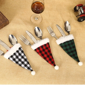 Christmas buffalo plaid cutlery holders with white plush trim for festive table decor