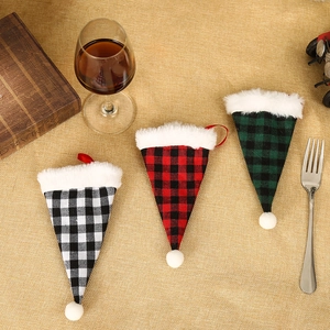 Christmas plaid cutlery holders with plush trim and mini pompoms for holiday table decor