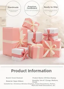 Detailed view of pink and white gift box set with silk ribbons for Christmas decoration