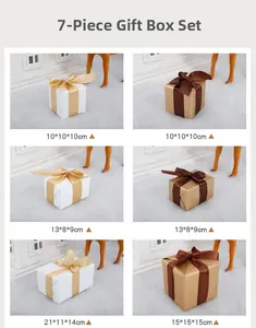 Set of 7 decorative gift boxes in gold and white with ribbons for holiday displays