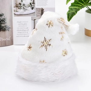 White plush Christmas hat with gold sequin snowflakes and fluffy pompom decor