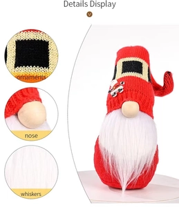 Detail view of a Christmas gnome with red knitted hat, wooden nose and long white whiskers