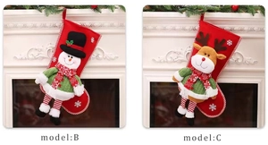 Detail view of 3D snowman and reindeer Christmas stockings with long striped legs