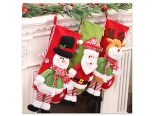Detailed view of three 3D Christmas stockings hanging on a white decorated mantel