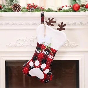 Christmas bone-shaped stockings with buffalo plaid pattern and festive reindeer antlers