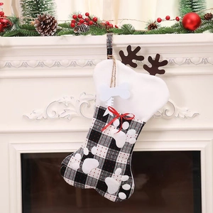 Plaid bone-shaped Christmas stocking with reindeer antlers and bow for holiday decor