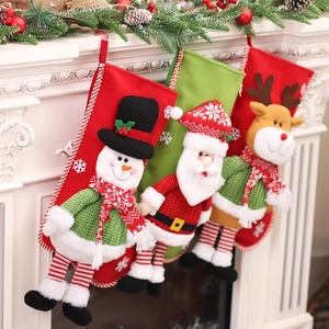 Three-piece Christmas stockings set with 3D Santa, Snowman and Reindeer hanging on fireplace