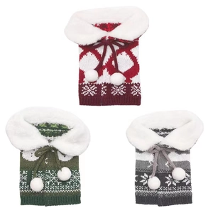 Three-piece knitted Christmas wine bottle covers with white faux fur collars and snowflakes
