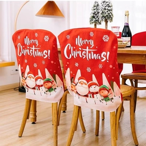 Red Christmas chair covers with Merry Christmas print and Santa Claus characters in dining room