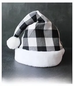 Close-up of black and white buffalo plaid Christmas hat with premium white plush trim