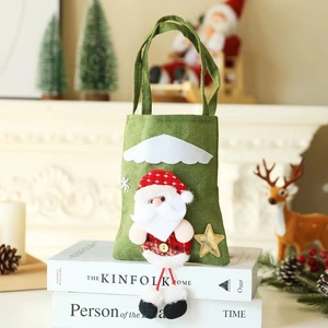 Green burlap Christmas gift bag featuring a 3D Santa Claus doll and golden star