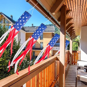 Outdoor American flag windsock for 4th of July party decoration hanging on wooden porch