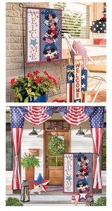 Detail view of Independence Day garden flag with gnomes and welcome text on metal stand