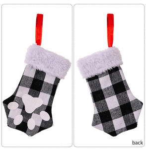 Front and back detail of Christmas cat paw stockings with buffalo plaid and faux fur trim