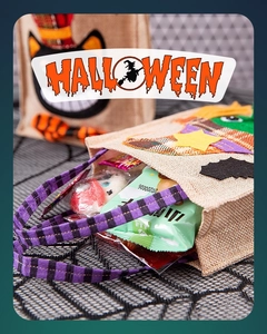Close-up of burlap Halloween treat bag with patchwork bat and stars filled with candy