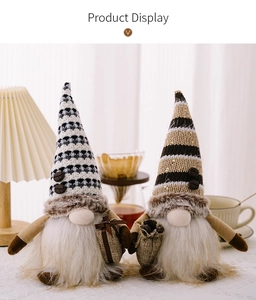 Detail of two handmade coffee gnomes with knitted hats and plush white beard decorations