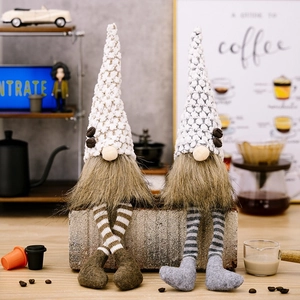Detail of coffee gnomes featuring knit hats with coffee beans and striped hanging legs