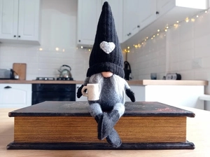 Nordic Christmas gnome plush with gray heart hat holding a white mini coffee mug decor