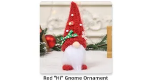 Close-up of a red Christmas gnome doll with a white beard and snowflake ribbon detail